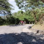 Riders climbing a hill, Guantanamo Mango bicycle tour