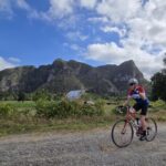 Mil Cumbres Ride - Dan cycling past Farm - FM, Gringo